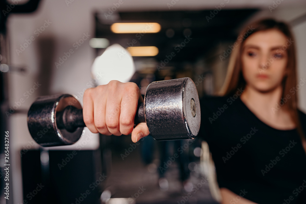 Fitness workout with dumbbell in hand. Close up. Fitness workout with dumbbell in hand. Close up.