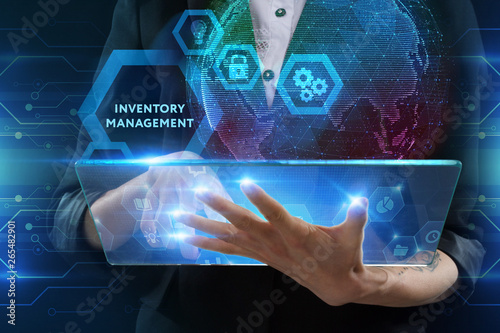 The concept of business, technology, the Internet and the network. A young entrepreneur working on a virtual screen of the future and sees the inscription: Inventory management