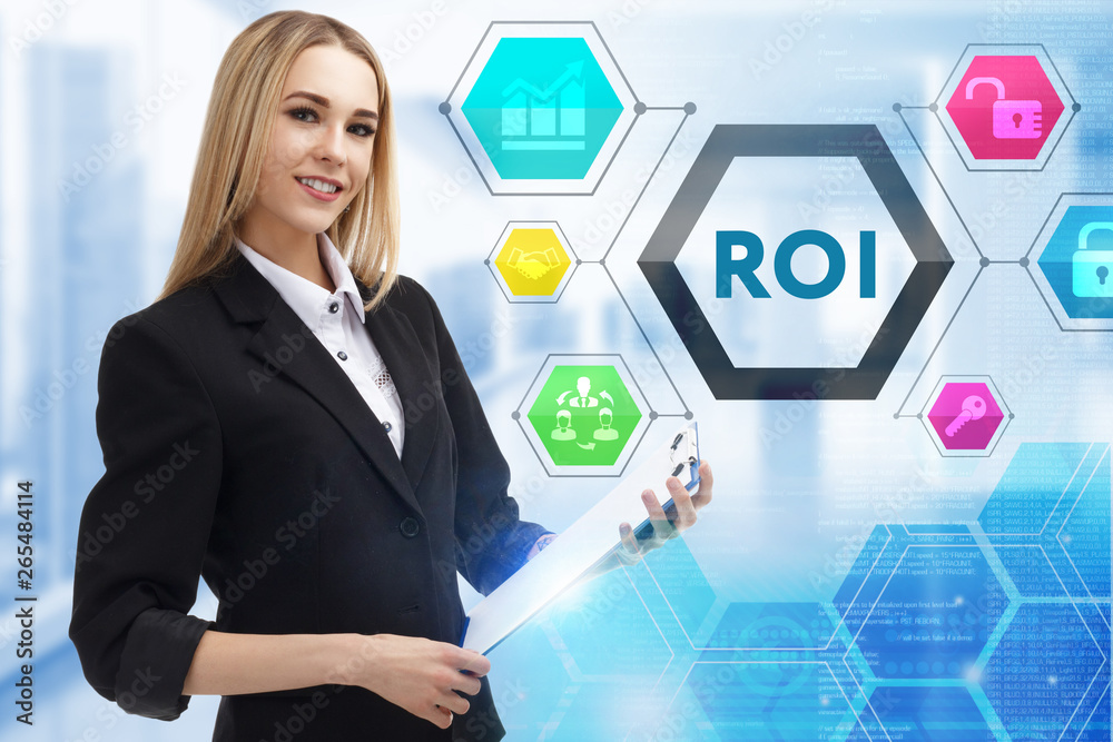 The concept of business, technology, the Internet and the network. A young entrepreneur working on a virtual screen of the future and sees the inscription: ROI The concept of business, technology, the Internet and the network. A young entrepreneur working on a virtual screen of the future and sees the inscription: ROI