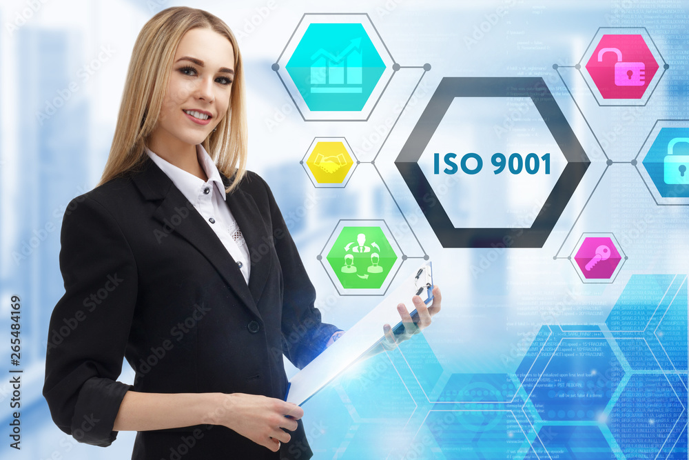 The concept of business, technology, the Internet and the network. A young entrepreneur working on a virtual screen of the future and sees the inscription: ISO 9001 The concept of business, technology, the Internet and the network. A young entrepreneur working on a virtual screen of the future and sees the inscription: ISO 9001