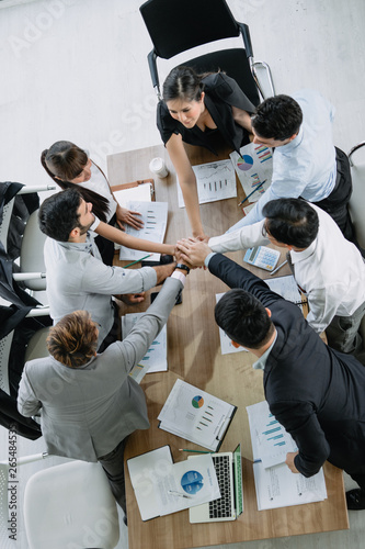 Business team colleague hands joining together in  the meeting room  office  from top view