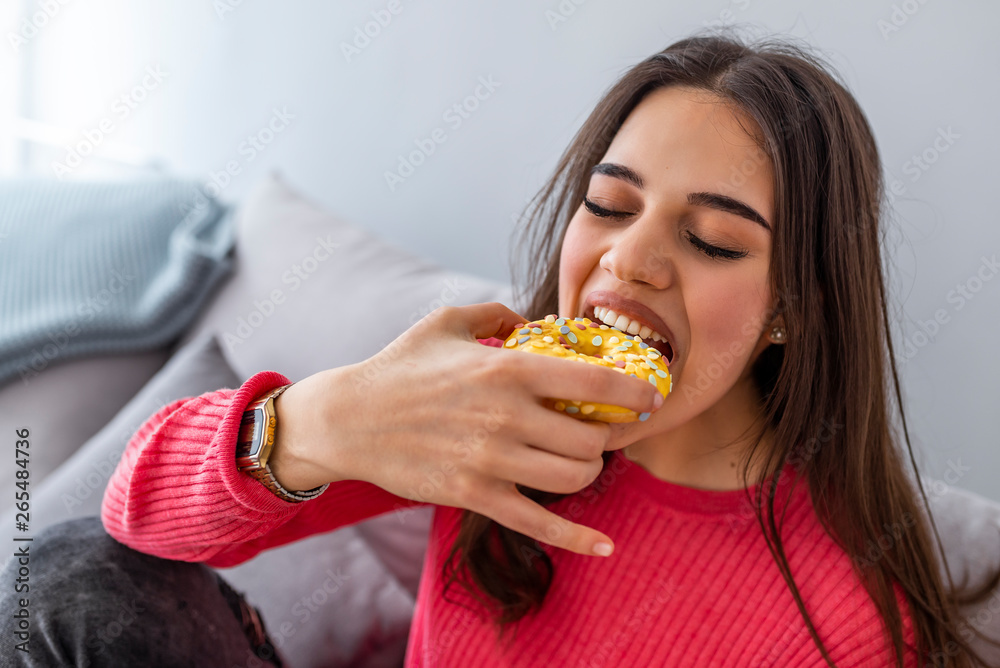 Woman is eating tasty sugary donuts. Diet is finished! Wow! Yum-yum! beautiful excited happy glad joyful woman is going to eat sweets, donuts at the weekend