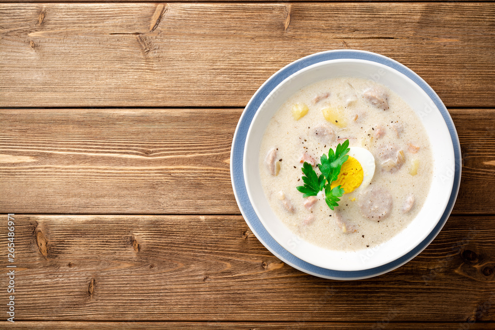 Traditional polish soup Zurek on wooden table. Top view. Copy space. Traditional polish soup Zurek on wooden table. Top view. Copy space.