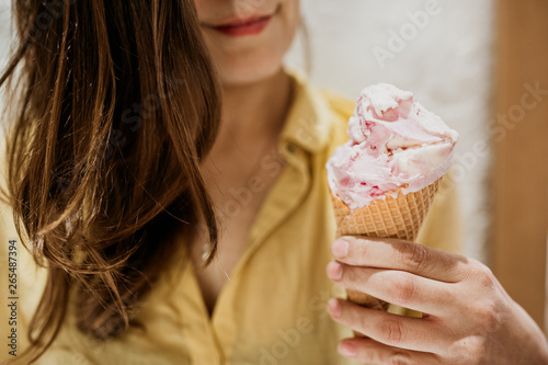 Young woman holding ice cream