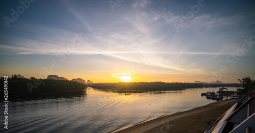 In the morning sky is beautiful.sky.Bright orange sky.mangrove forest. © BUDDEE