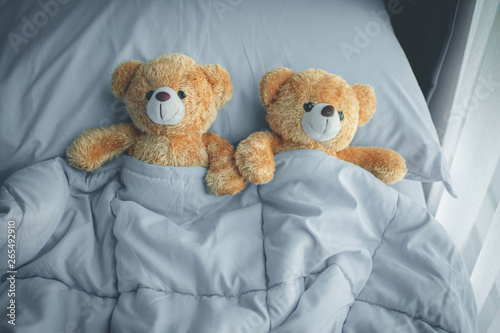 Tableau sur toile couple love bear doll lying on bed room, feel like happy and low key