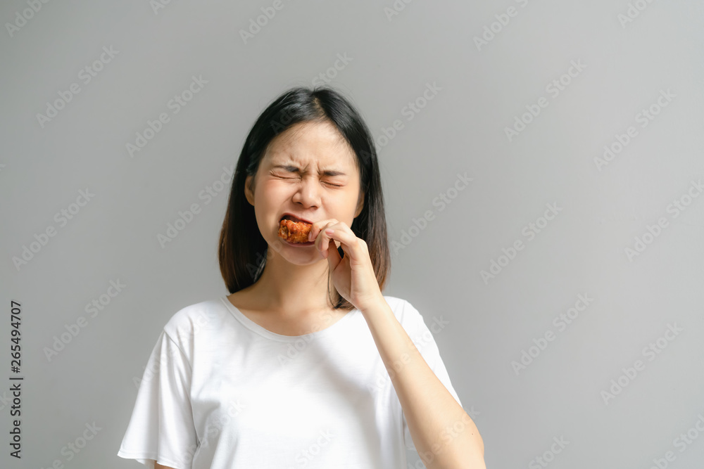 Happy woman holding fried chicken for eat. Happy woman holding fried chicken for eat.