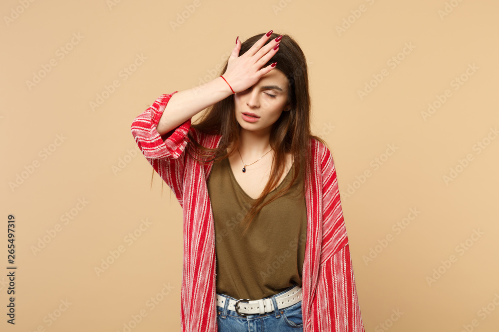Portrait of exhausted young woman in casual clothes keeping eyes closed, putting palm on face isolated on pastel beige wall background. People sincere emotions, lifestyle concept. Mock up copy space. Portrait of exhausted young woman in casual clothes keeping eyes closed, putting palm on face isolated on pastel beige wall background. People sincere emotions, lifestyle concept. Mock up copy space.