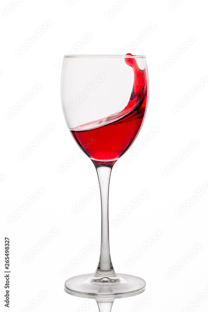 Red wine splash in a glass isolated on white background Red wine splash in a glass isolated on white background