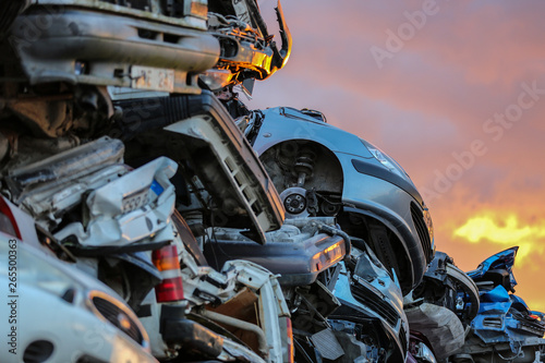 Fototapeta Naklejka Na Ścianę i Meble -  Details of used cars in a junkyard at sunset, Gotland Sweden.