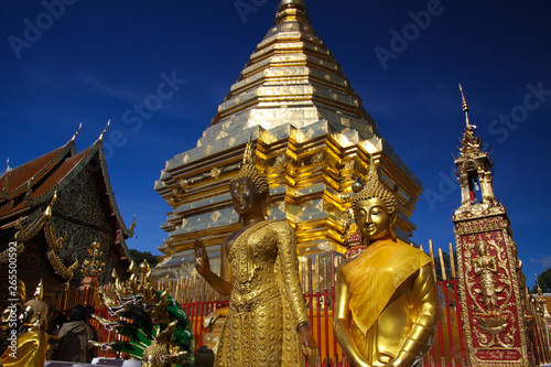 Golden roofs and towers of pagoda contrasting with dark blue cloudless sky - Wat Phra That Doi Suthep pagoda in Chiang Mai  Thailand