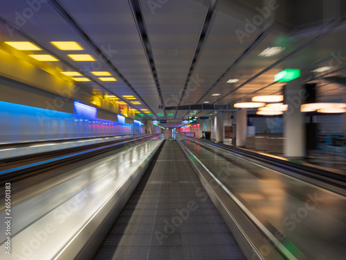 Long Exposure moving walkway with neon light at underground