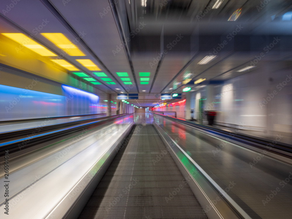 Long Exposure moving walkway with neon light at underground Long Exposure moving walkway with neon light at underground