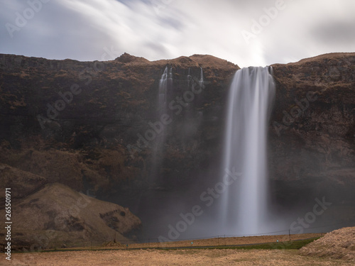 The Iceland Seljalandsfoss during cold Spring