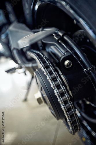 View of the back of a motorcycle with an emphasis on the chain. © trek6500