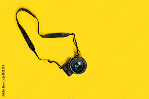 Canvas Print Mirrorless black camera on yellow background, summer memmories photograher blog