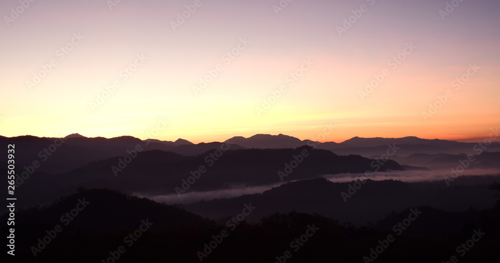 Mountain views are complex, with fog and colorful skies during the rising sun.