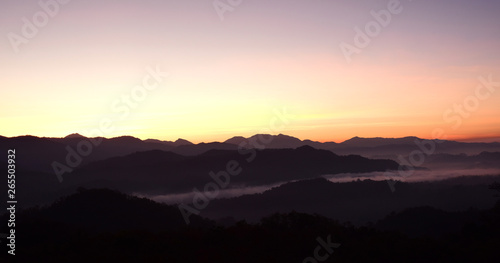 Mountain views are complex  with fog and colorful skies during the rising sun.