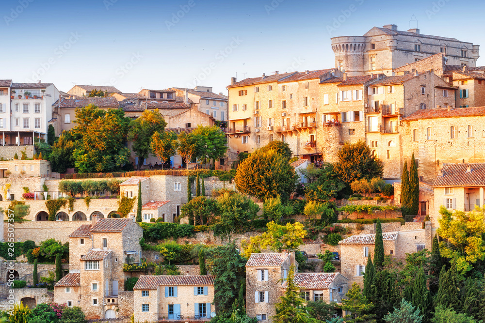 French famous landmark in Provence - old town Gordes. Amazing sunset view on panorama. Iconic travel destination spot in France, Provence - medieval city Gordes in Luberon area. 