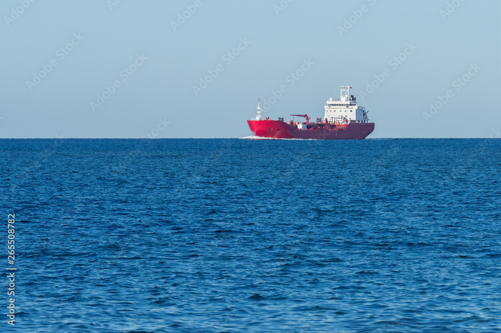 red cargo barge at sea