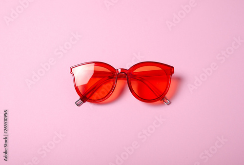 Flat lay. Sunglasses fashion on color pink background