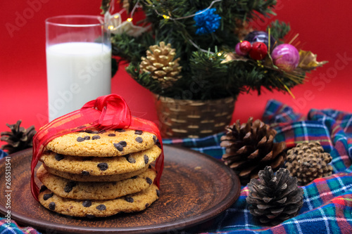 A glass of milk and cookies for Santa. Christmas Eve Concept.