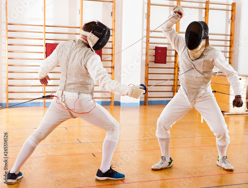 Fencers exercising techniques in battle