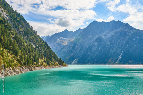 Dam with big lake in austrian Alps / Reservoir "Schlegeis" in a Valley in Austria