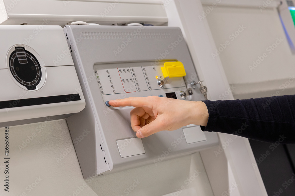 Electrician Checking Fire Alarm Panel In Datacenter Electrician Checking Fire Alarm Panel In Datacenter