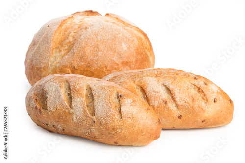 Pair of loaves and a big of bread isolated on white background, close up.