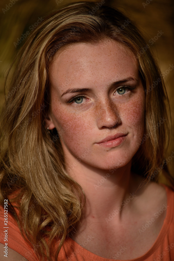 portrait of a young beautiful girl with freckles portrait of a young beautiful girl with freckles
