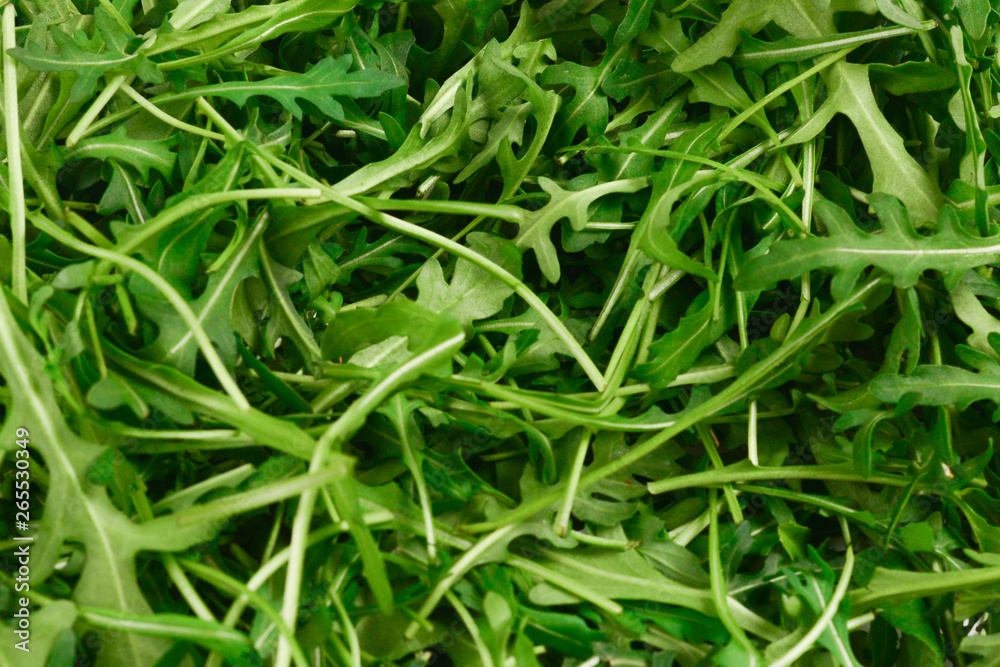 Fresh leaves of arugula as background. Fresh leaves of arugula as background.