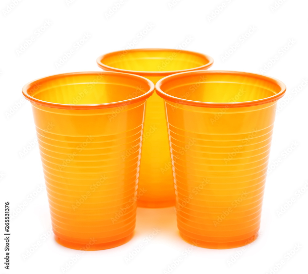 Orange plastic cups isolated on white background Orange plastic cups isolated on white background