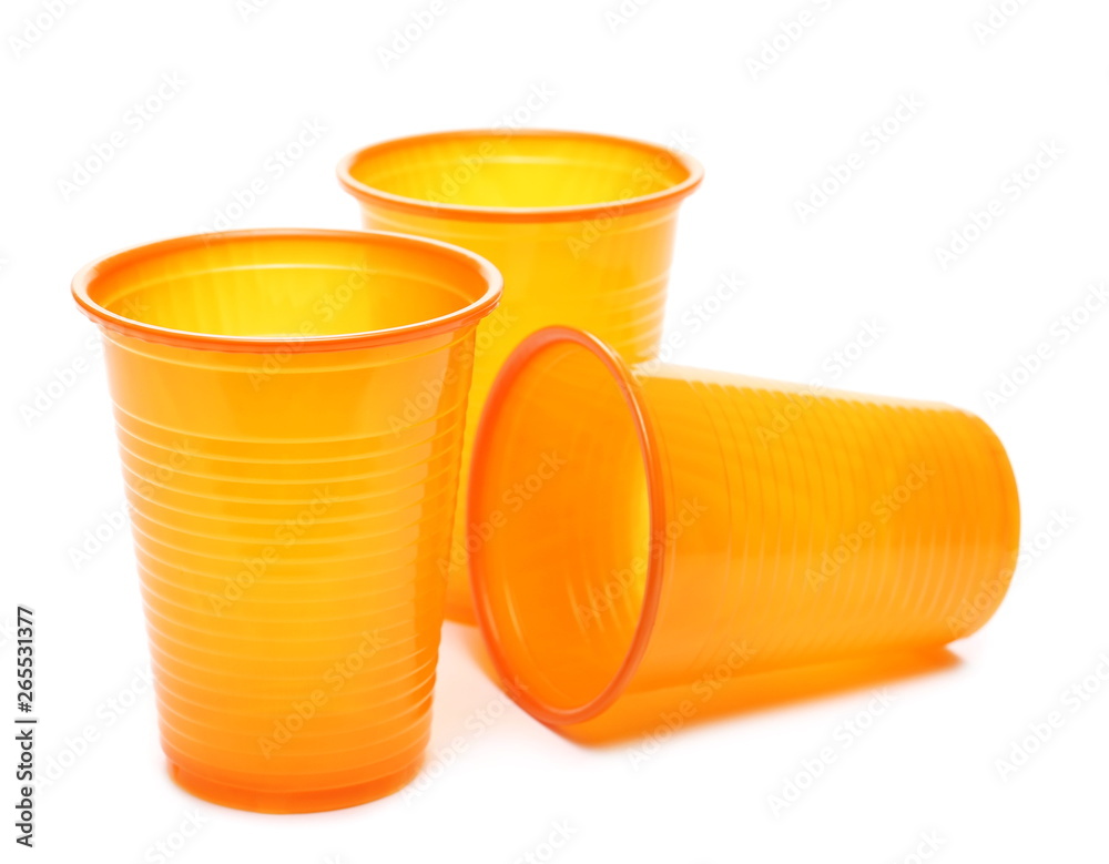 Orange plastic cups isolated on white background Orange plastic cups isolated on white background