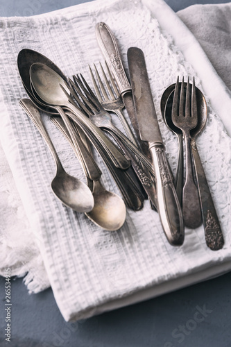 Vintage flatware on antique linen