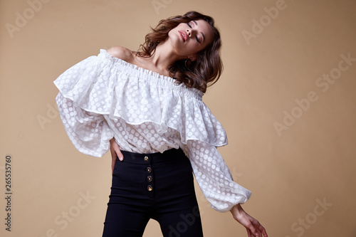 Sexy beautiful woman fashion glamour model brunette hair makeup wear silk blouse trousers clothes for every day casual party style accessory date walk girl skinny body shape studio. photo