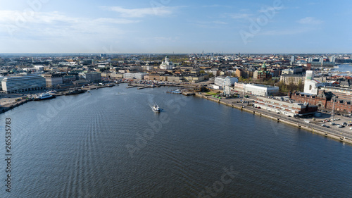 Beautiful sunny aerial cityscape with Helsinki Cathedral, South Harbor and Market Square Kauppatori , Finland. Blue sky with clouds.