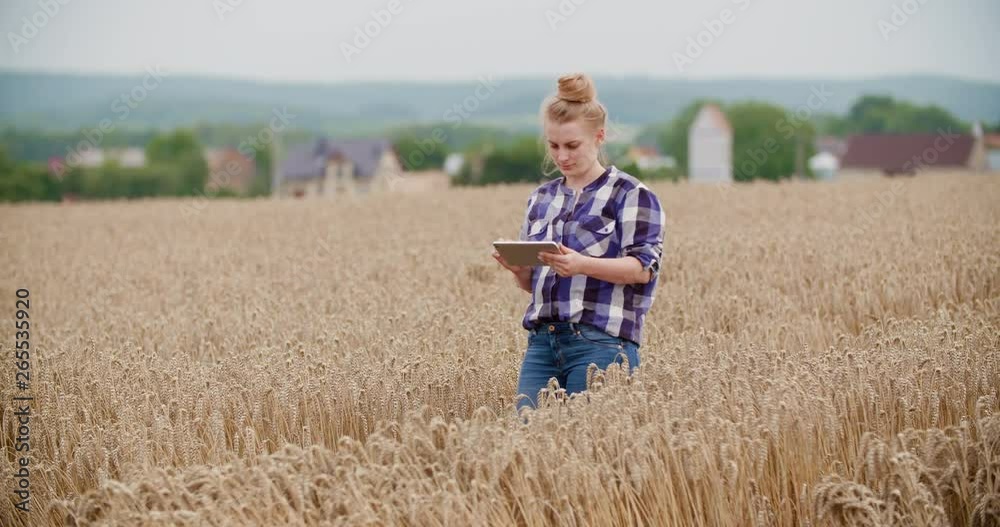 Portrait of female farmer with digital tablet at farm