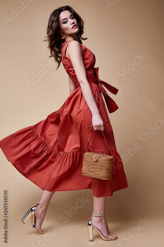 Pretty beautiful sexy elegance woman skin tan body fashion model glamor pose wear trend dress casual clothes party summer collection makeup hair style brunette success accessory jewelry studio. photo