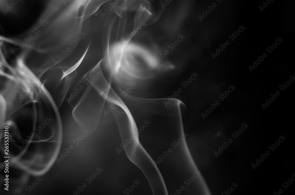 White smoke on a black background. Abstract elegant monochrome background. White smoke on a black background. Abstract elegant monochrome background.