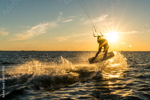 kitesurfing in sunset photo