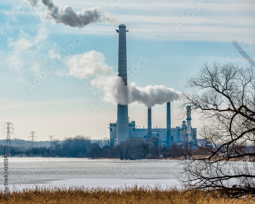 Coal power plant with gases and pollutants coming out of smoke stacks - off the Minnesota River and major bird migration route
