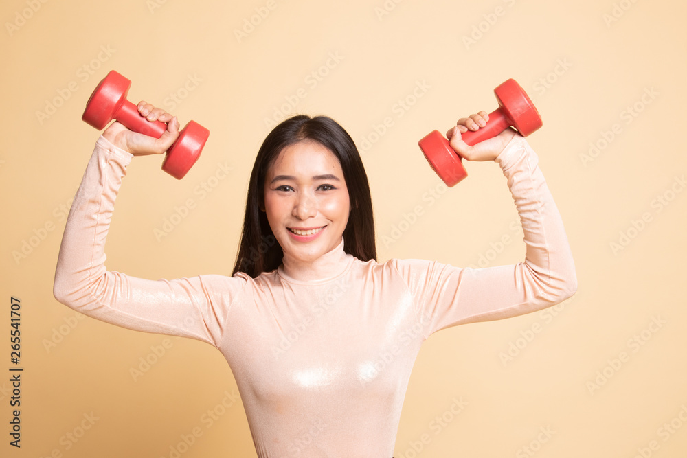 Healthy Asian woman with dumbbells. Healthy Asian woman with dumbbells.
