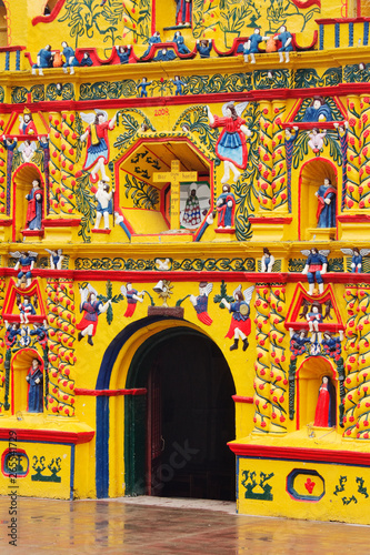 Colorful facade of Church of San Andres Xecul, Guatemala photo