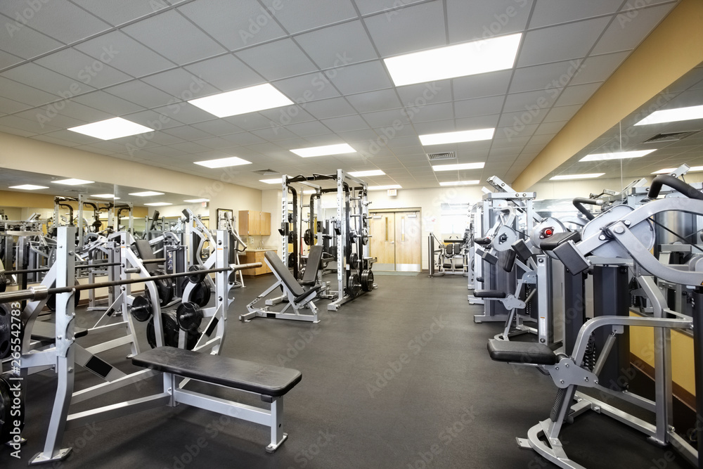 Exercise equipment in empty gym Exercise equipment in empty gym