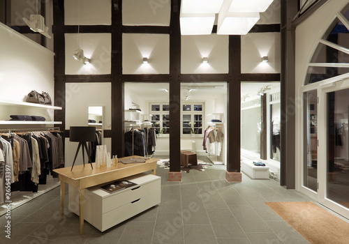 Clothes for sale in modern store photo