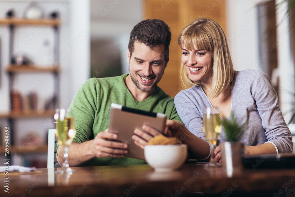 Young couple shopping on internet with tablet Young couple shopping on internet with tablet
