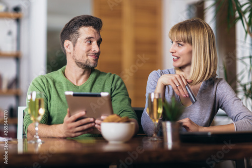 Young couple shopping on internet with tablet