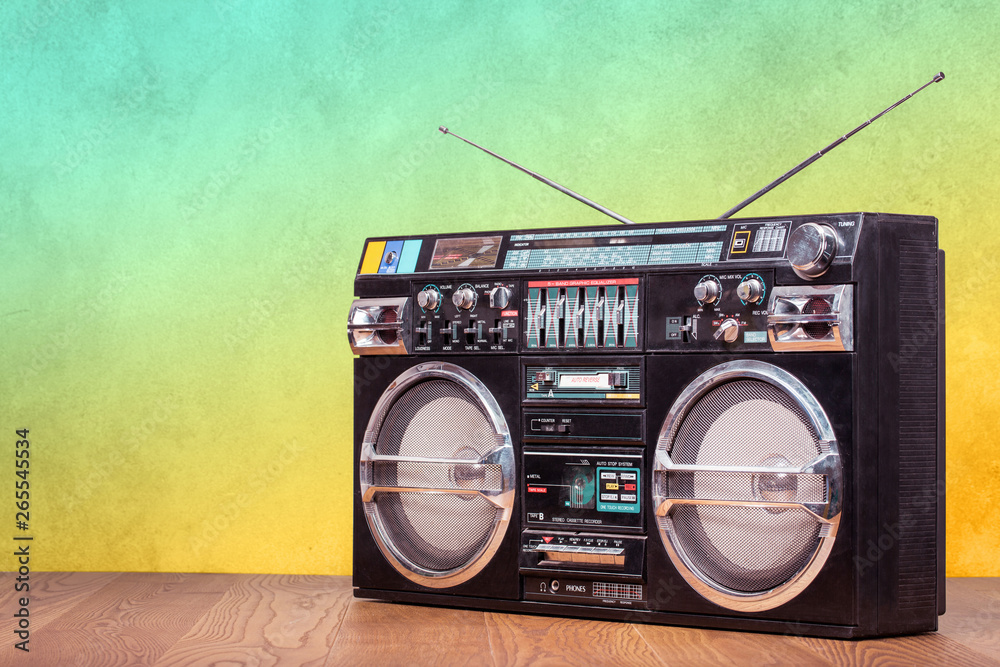 Retro boombox ghetto blaster outdated portable radio receiver with cassette  recorder from 80s front gradient colored wall background. Rap, Hip Hop, R&B  music concept. Vintage old style filtered photo Stock Photo
