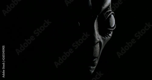 Grey alien creature has messages for human. posing in front of the camera